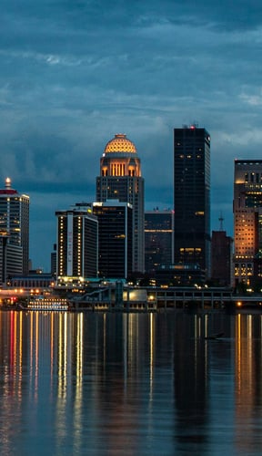 Louisville skyline reflected in the Ohio River at dusk