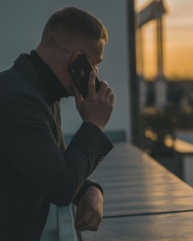 Property manager responding to a guest emergency on a phone at night